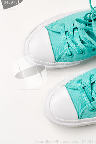 Image of Top view of sneakers on white background.