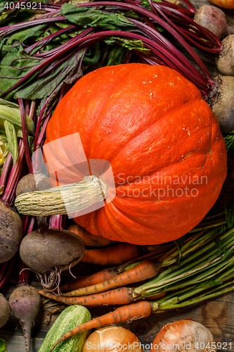 Image of Orange pumpkin with other veggies