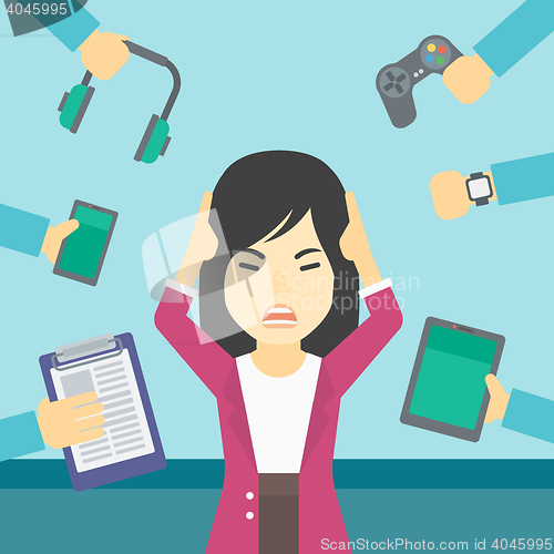 Image of Woman surrounded with her gadgets.