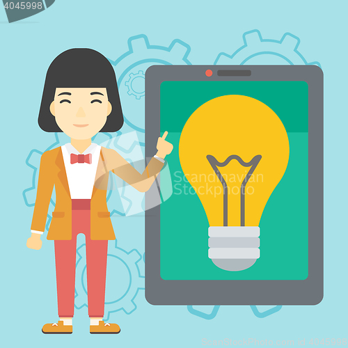 Image of Woman pointing at big tablet computer.