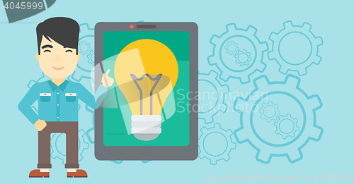 Image of Man pointing at big tablet computer.