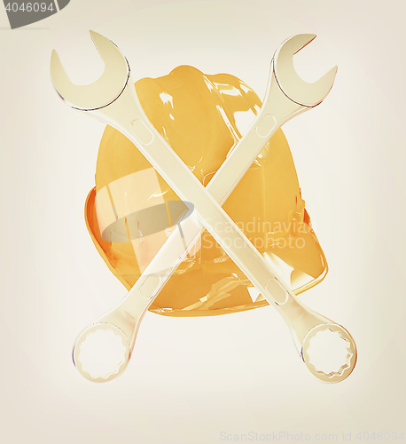 Image of The protective helmet working and crossed wrenches. The image of