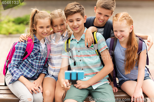 Image of happy elementary school students taking selfie