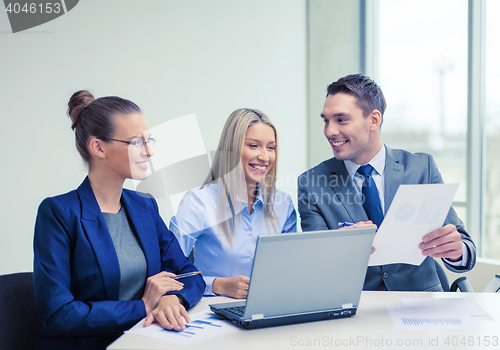 Image of business team with laptop having discussion