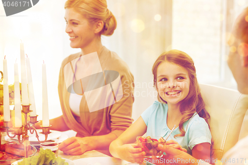 Image of smiling family having holiday dinner at home