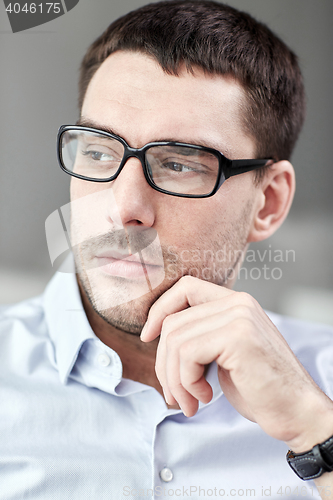 Image of portrait of  businessman in eyeglasses at office