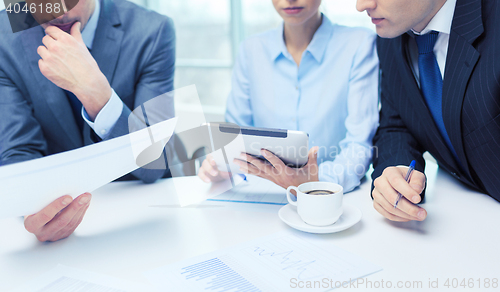 Image of business team with graph, tablet pc and coffee