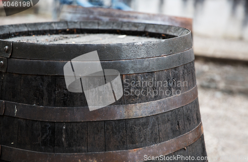 Image of close up of old wooden barrel outdoors