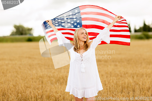 Image of happy woman with american flag on cereal field