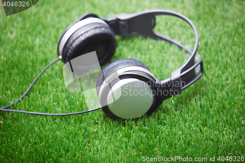 Image of Headphones in a grass