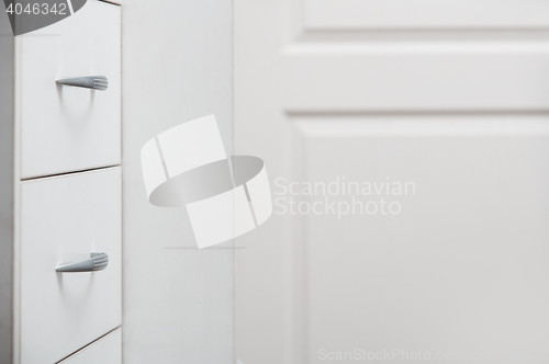 Image of Cabinet with sliding trays and chrome handles