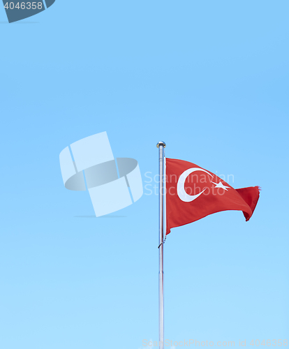 Image of Turkish flag against sky background