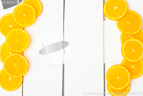 Image of Colorful citrus fruits on the rustic white background.