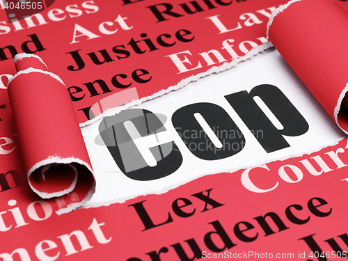 Image of Law concept: black text Cop under the piece of  torn paper