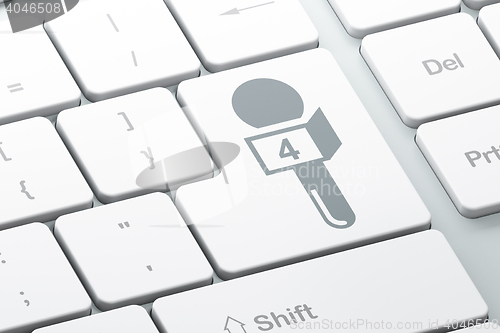 Image of News concept: Microphone on computer keyboard background