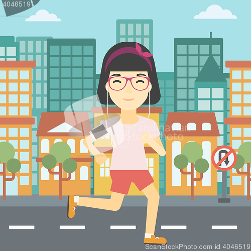 Image of Woman running with earphones and smartphone.