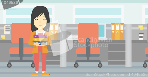 Image of Business woman holding pile of folders.