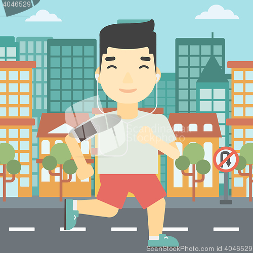 Image of Man running with earphones and smartphone.