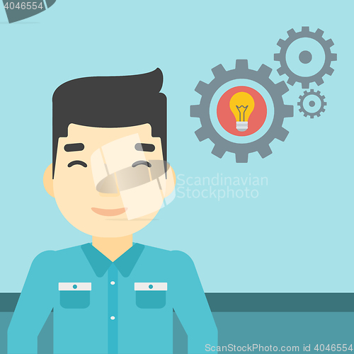 Image of Man with business idea bulb in gear.