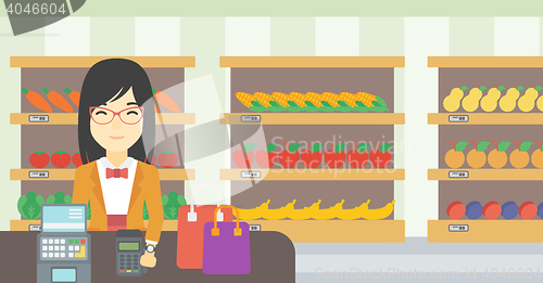 Image of Woman paying wireless with smart watch.