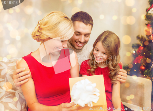 Image of happy family opening gift box