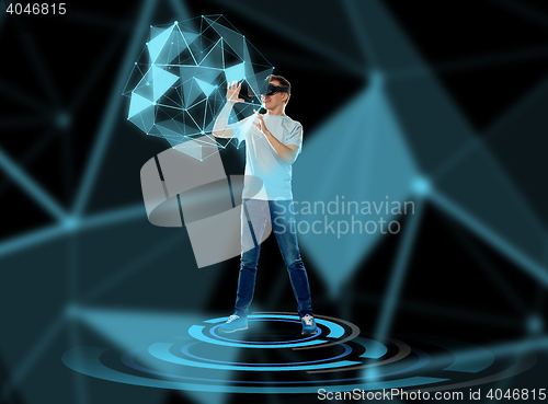 Image of happy man in virtual reality headset or 3d glasses