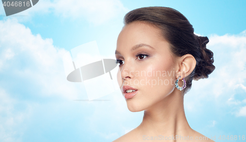 Image of close up of beautiful woman face with earring