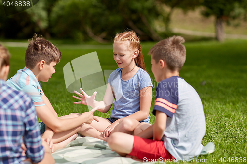 Image of happy kids playing rock-paper-scissors game