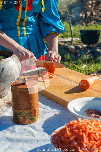 Image of ussian table with food preparation: