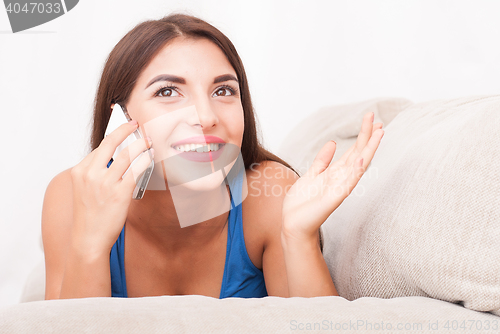 Image of portrait of beautiful girl talking by phone