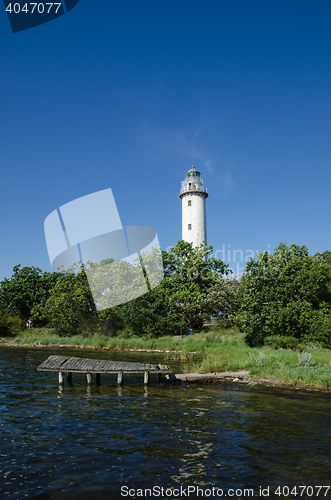 Image of Lighthouse and an old wooden pier