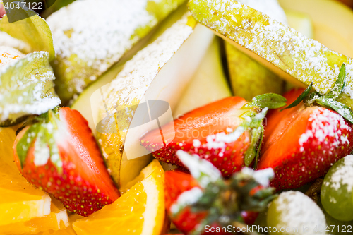 Image of close up of dish with sugared fruit dessert