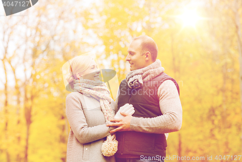 Image of smiling couple in autumn park