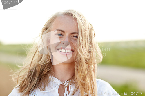 Image of close up of happy young woman in white outdoors