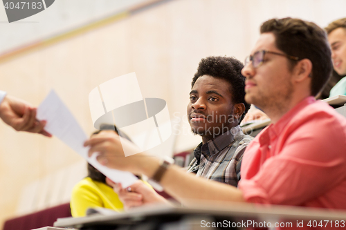 Image of international students with test on lecture