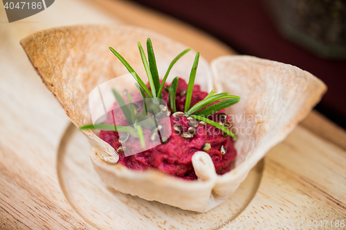 Image of close up of dough cornet with beetroot filling