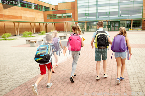 Image of group of happy elementary school students running