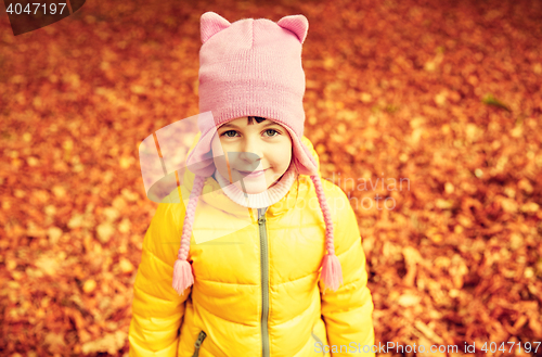 Image of happy little girl in autumn park