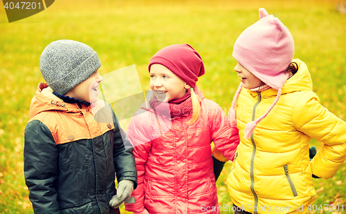 Image of group of happy children in autumn park
