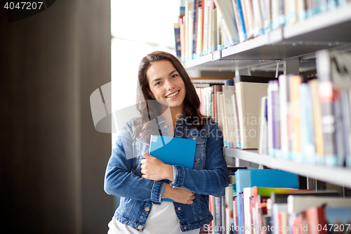 Image of high school student girl reading book at library