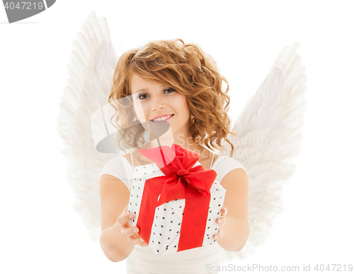 Image of happy young woman with angel wings and gift box