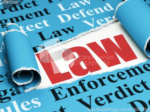 Image of Law concept: red text Law under the piece of  torn paper