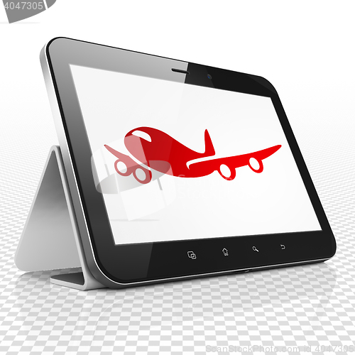 Image of Tourism concept: Tablet Computer with Airplane on display
