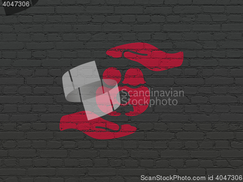 Image of Insurance concept: Family And Palm on wall background