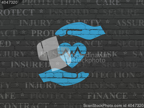 Image of Insurance concept: Heart And Palm on wall background