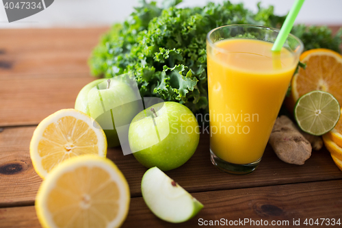 Image of glass of orange juice, fruits and vegetables