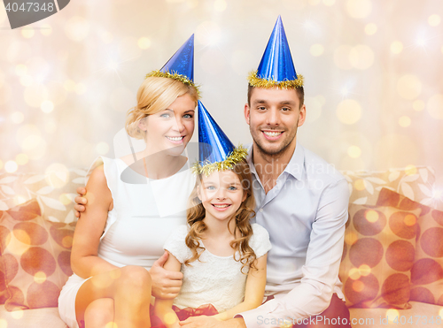 Image of happy family in hats celebrating