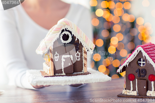 Image of close up of woman showing gingerbread house