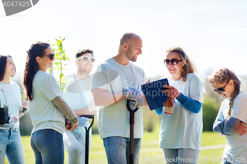 Image of group of volunteers planting trees in park