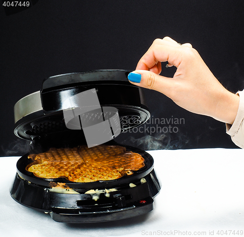 Image of Person making fresh waffles